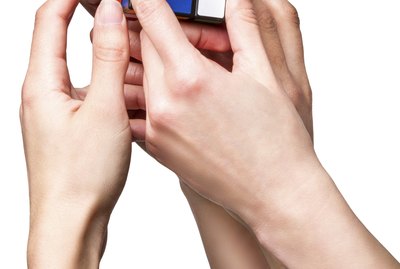 Hands holding color cube
