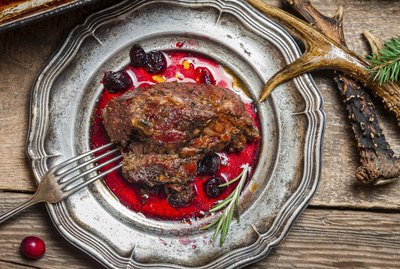 Venison served with cranberry sauce