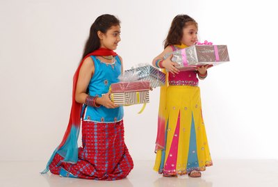 Two girls holding gifts, children