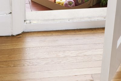 Cardboard box of assorted vegetables at house doors