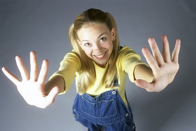 High angle view of a teenage girl with her arms stretched out