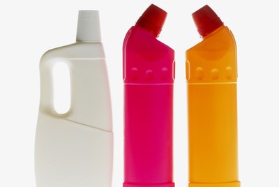 Close-up view of three cleaning product bottles