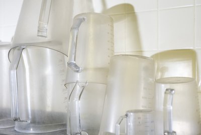 Clear measuring cups on shelf