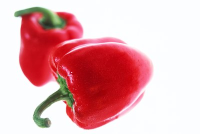 close-up of two red bell peppers