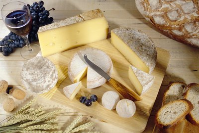 Cheeses on cutting board