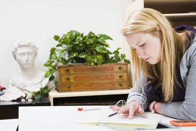Woman drawing on a sheet