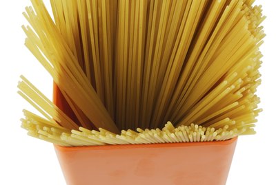 Container of uncooked spaghetti
