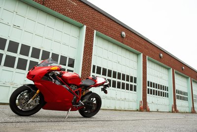 Motorcycle in front of garage doors