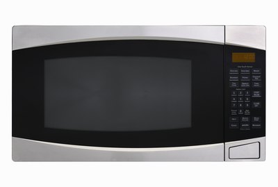 Stainless steel microwave oven on white