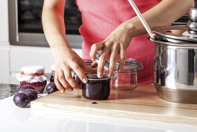 Woman closing the jars