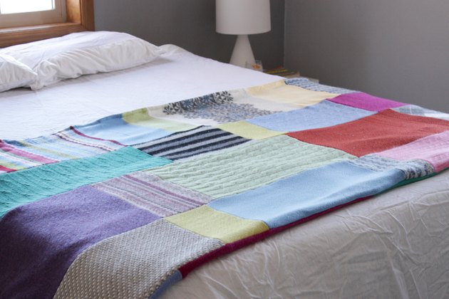 Snuggle up with a good book, a warm cup of tea, and your favorite jammies under this upcycled sweater quilt that you made yourself.