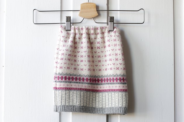 Pull out an old sweater from the bottom of your closet and create a cute and cozy sweater skirt for a little girl in your life.