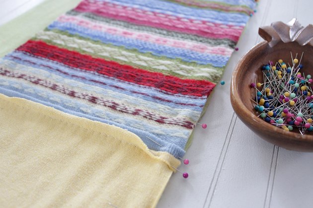 Snuggle up with a good book, a warm cup of tea, and your favorite jammies under this upcycled sweater quilt that you made yourself.