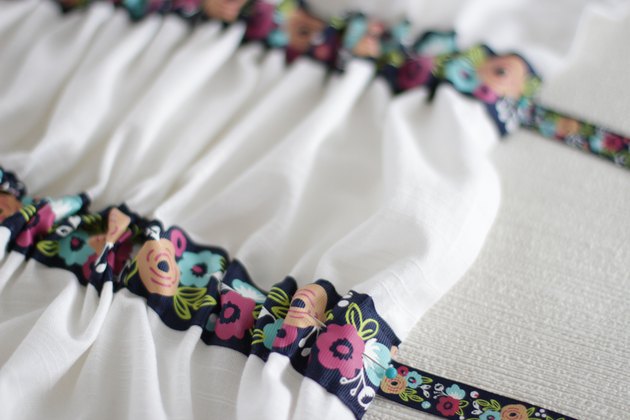 Instead of just hanging your towel over a cupboard door or throwing it on the counter, add a little ribbon to the top so you can give it a place of honor in your kitchen and hang it from your oven door.