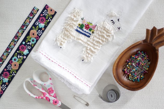 Instead of just hanging your towel over a cupboard door or throwing it on the counter, add a little ribbon to the top so you can give it a place of honor in your kitchen and hang it from your oven door.