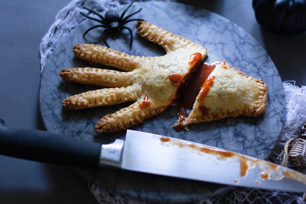 Severed hand meat pie with hot sauce