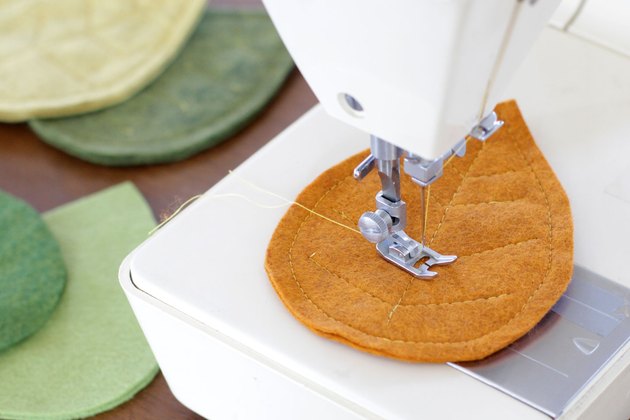 Bring that colorful fall feeling inside your home by creating a few vibrant felt coasters to protect your coffee table from those steaming cups of hot cocoa you'll be sipping.