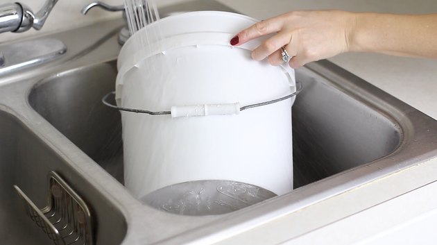 Running cold water on the sides of the bucket