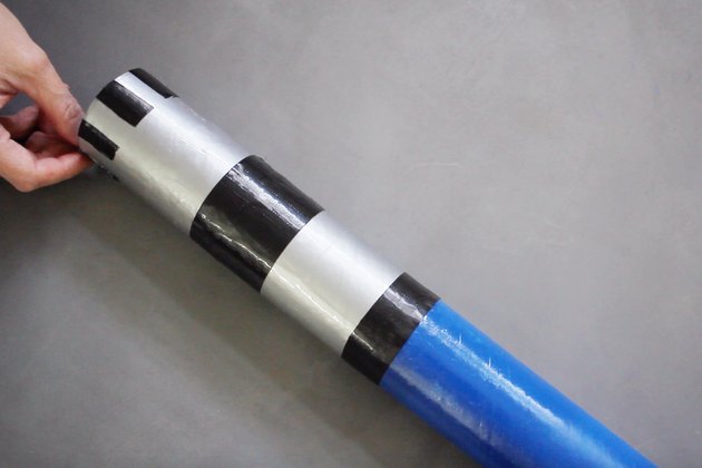 Black tape strips taped to mailing tube