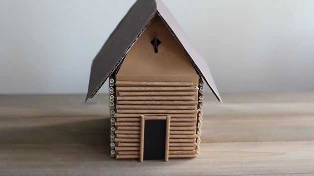 Paper door glued to front of box