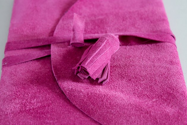 There are loads of unwanted suede jackets hanging around the thrift stores that can be made into these beautiful journal covers.