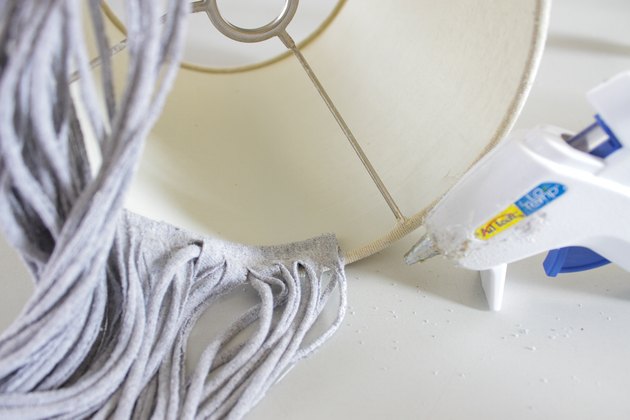 Find a few old t-shirts that have been hanging around your closet and create a whimsical fringe shade.