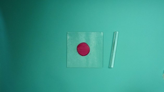 Rolling out ball of clay