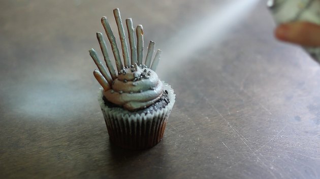 Spraying cupcake silver