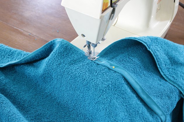 Nothing like staying wet to beat the heat. But when it's time to dry off, don't just use any old towel, nope, wrap your kids up in a DIY hooded towel they can wear.