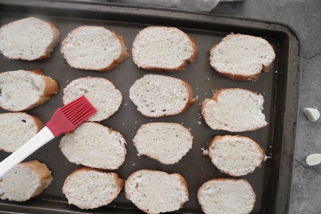 Brush bread with olive oil