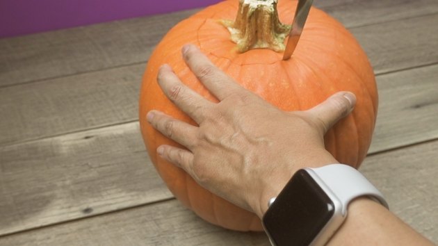 Removing top of pumpkin to make DIY Pumpkin Keg