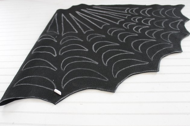 Embrace your spooky side, add a little mystery to your wardrobe and you might even catch some fun in your web when you wear this easy-to-make, no-sew, felt spider web poncho.