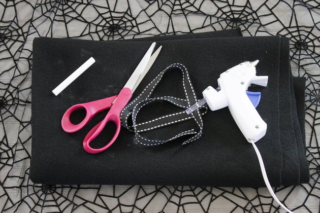 Embrace your spooky side, add a little mystery to your wardrobe and you might even catch some fun in your web when you wear this easy-to-make, no-sew, felt spider web poncho.