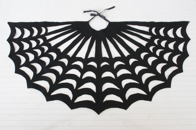 Embrace your spooky side, add a little mystery to your wardrobe and you might even catch some fun in your web when you wear this easy-to-make, no-sew, felt spider web poncho.