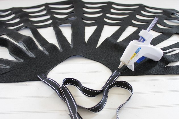 Embrace your spooky side, add a little mystery to your wardrobe and you might even catch some fun in your web when you wear this easy-to-make, no-sew, felt spider web poncho.
