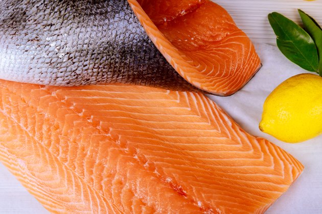 High Angle View Of Fish With Lemon On Table