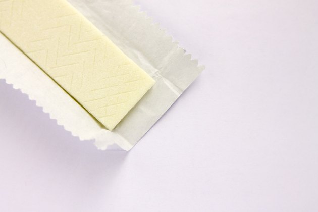 Plate of chewing gum in an open wrapper on a white background