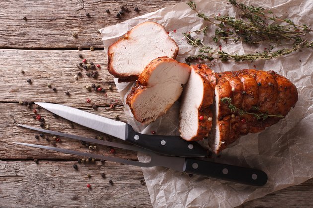 rustic food: roasted turkey breast on table. horizontal top view