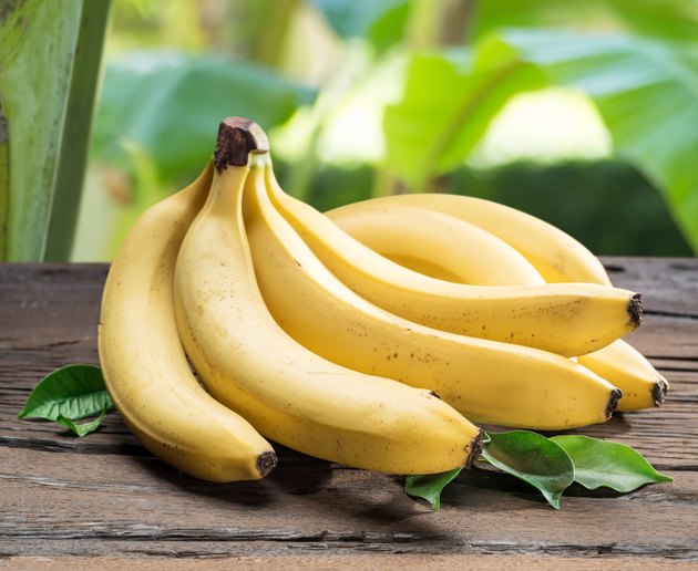 Banana bunch on the wooden table.