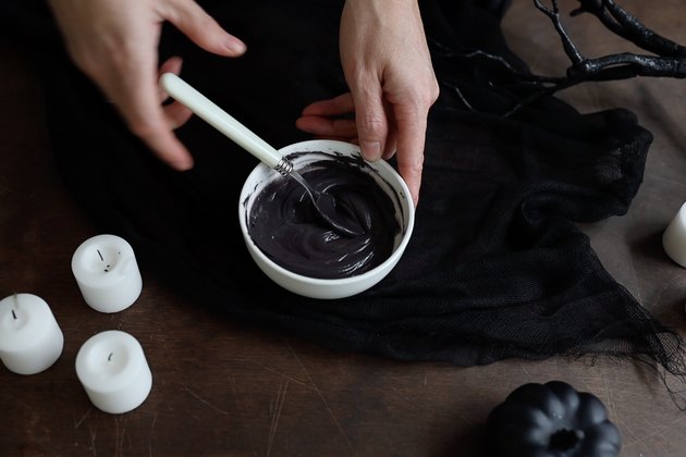 Stirring melted black candy melts