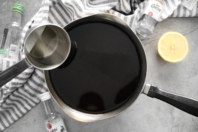 Add lemon juice, water and liquor