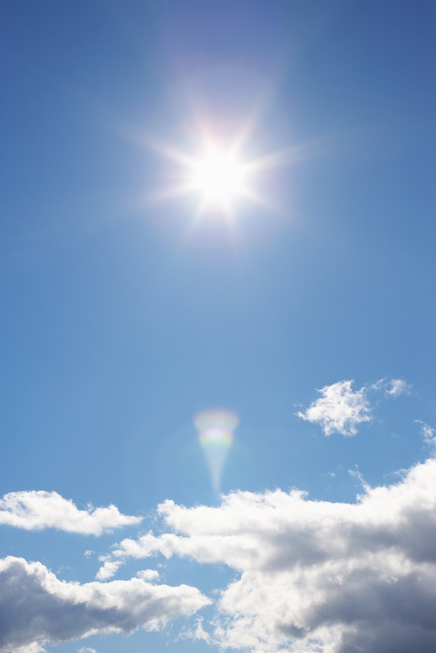 Sunlight shining above clouds