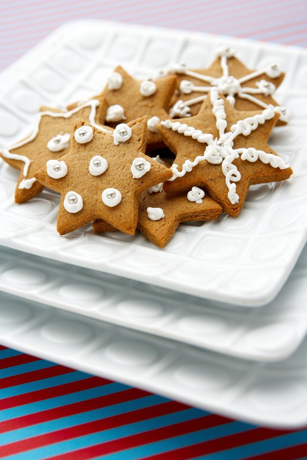 Decorated star-shaped cookies on plate
