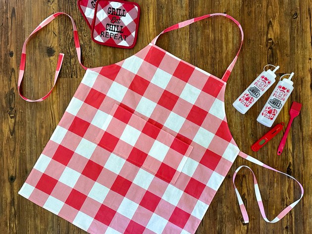 A Gingham Grilling Apron with Pockets for Tools