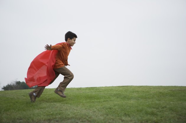 Boy running with cape