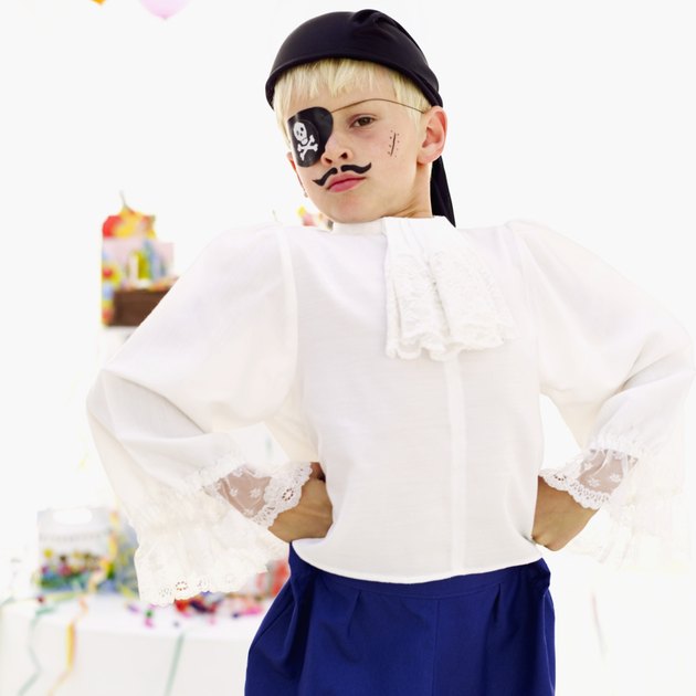 Portrait of a boy (9-11) dressed as a pirate