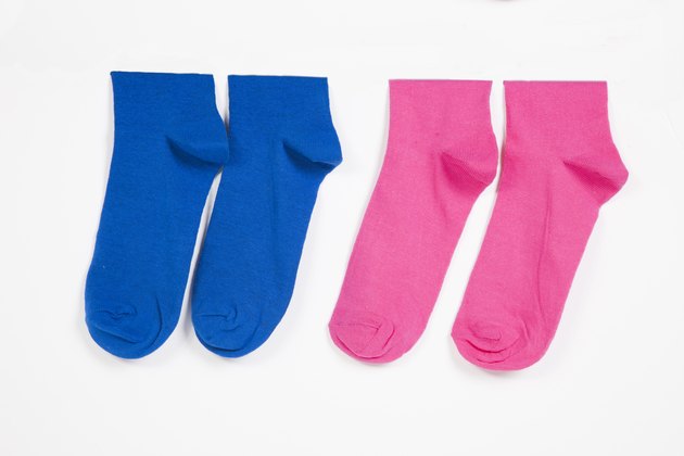 Close-up of socks hanging over white background