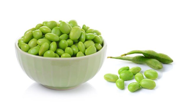 Edamame soy beans in bowls on white background
