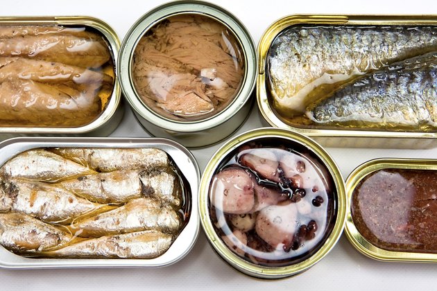 different tin cans isolated on white