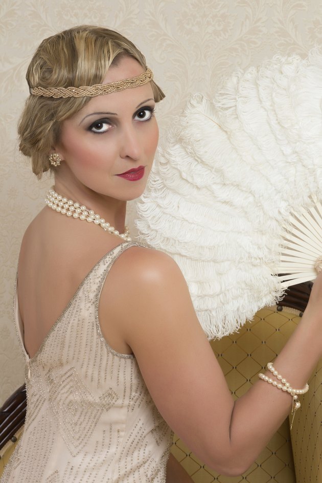 Vintage twenties lady wearing a headband and flapper dress